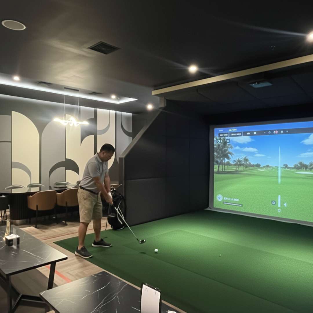 Indoor golf experience at MST Golf in Agora Mall, ideal for after-work relaxation and networking.